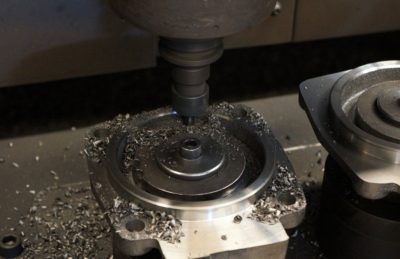 The end-mill tool cutting the machine part by CNC milling